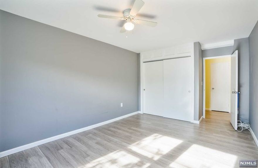 Discover the essence of carefree living in this beautifully updated condo located in the heart of Maplewood, NJ. Nestled just minutes from the train, this third-floor single-level residence boasts a prime location combined with unmatched amenities. The welcoming open concept design effortlessly flows between the living room, dining area, and a modern kitchen equipped with a dishwasher, microwave, refrigerator, and a sleek wall oven. A spacious hallway presents ample storage with a walk-in closet, an additional closet, and a pantry. This condo features two generously sized bedrooms, including a master suite with a private ensuite bathroom, complemented by an additional full bathroom. Convenience is paramount with floor-level laundry, storage facilities, elevator access, and two assigned parking spaces, not to mention additional parking for your guests.