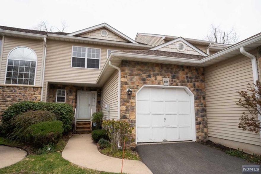 Charming 3-bed, 2.5-bath townhouse boasts office space, formal dining, living room with fireplace and a deck off the dining room. Primary en suite with walk-in closet & double sinks. Spacious bedrooms share full bath. 1st-floor laundry, unfinished basement with high ceilings offers potential. 1-car garage with interior access. Convenient to highways, transport, shops, & dining. TLC needed, sold as-is. 1-year home warranty included.