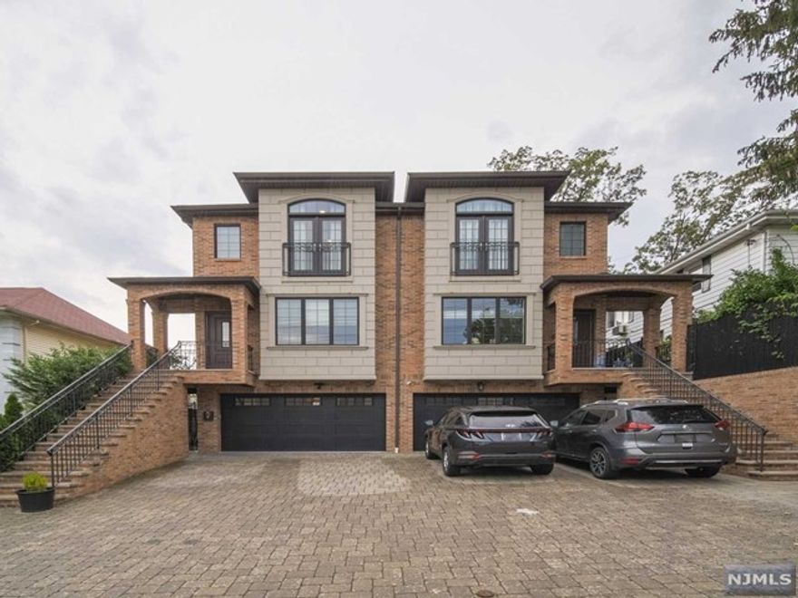 OVERSIZED ALL BRICK DUPLEX BUILT IN 2015 LOCATED IN THE HEART OF FORT LEE. SO CLOSE TO THE GWB, MAIN STREET, LIBRARY, ALL SCHOOLS AND NYC TRANSPORTATION CONVENIENTLY AT YOUR DOORSTEP. MAIN LEVEL WITH INVITING 9FT HIGH CEILINGS, OPEN FLOOR PLAN, LIVING ROOM WITH FIREPLACE, DINING ROOM, MODERN AND LARGE KITCHEN WITH ISLAND, QUARTZ COUNTERTOPS AND STAINLESS STEEL APPLIANCES. FAMILY ROOM LEADING TO PATIO WITH SLIDING GLASS DOOR WHICH HAS A BEAUTIFUL PRIVATE FENCED BACK YARD. SECOND LEVEL FEATURES MASTER BEDROOM WITH WALK-IN CLOSET, MASTER BATHROOM WITH DOUBLE VANITY SINKS, JACUZZI TUB, AND SEPARATE SHOWER STALL PLUS AN ADDITIONAL TWO BEDROOMS WITH FULL BATH IN HALLWAY, AND LAUNDRY ROOM. GROUND LEVEL HAS SIDE ENTRY DOOR WITH RECREATION ROOM, OFFICE OR BEDROOM WITH HALF BATHROOM. ADDITIONAL FEATURES INCLUDE MULTI-ZONE HEATING AND CAC, RECESSED LIGHTING, PAVER DRIVEWAY AND WALKWAY. THIS WON'T LAST, MAKE AN OFFER TODAY!