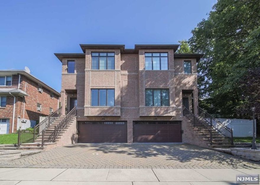 Modern and custom-built duplex constructed by a prominent local developer situated on a dead end street for. This home showcases elegant design and modern conveniences. Home features 3 bedrooms with vaulted ceilings, 3 full and 1 half baths, a gracious open floor plan, hardwood floors, and ample closet space. The ultra-modern eat-in kitchen is outfitted with custom cabinetry, high-end stainless steel appliances, and a huge center island with quartz countertops - a chef's delight! Master bedroom with walk-in closet & spa style bath with Jacuzzi tub. Dramatic 11 ft ceilings in living & dining rooms, radiant heat, gleaming hardwood flooring, video surveillance & security system, Bluetooth sound system, finished custom closets, central vac. Spray foam insulation and reinforced steel poured concrete foundation. 2-car attached garage, beautiful yard for outdoor entertaining. Located in a great area for an easy commute. Close to transportation, shopping, and restaurants