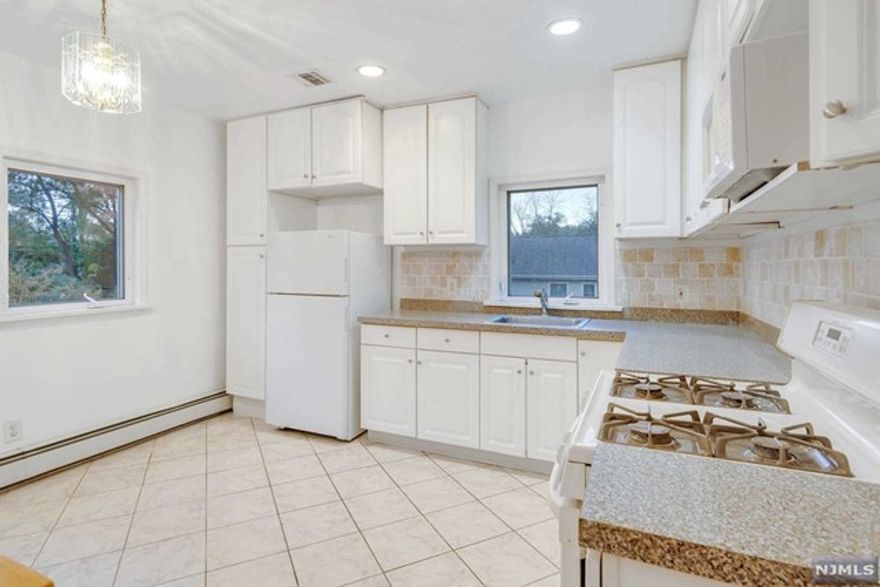 In the heart of Saddle Brook, clean and bright 2 bedroom apartment, located on the second floor of a two family house where owner lives on the first floor. Spacious, white kitchen beside a large living room, two great size bedrooms and a spotless bathroom. Gorgeous hardwood floor throughout, central A/C and baseboard heat. Laundry hook up available, tenant must provide their own washer and dryer, two car parking tandem. No pets of any kind.