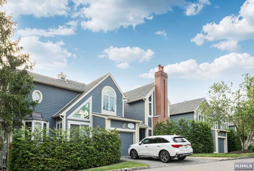 Welcome to this spacious 2 bedroom, 2 bath condo located in the highly sought after gated community of Cambridge Heights. Enjoy the best, private location with stunning views of the pond, providing a serene and picturesque setting. The entrance foyer opens to the living room featuring a cathedral ceiling, skylights, fireplace, & an expansive wall of windows, creating a bright and inviting atmosphere. French doors lead to a deck, offering a perfect spot to unwind and enjoy the beautiful surroundings. The dining room, kitchen, guest bedroom, hall bath, & primary bedroom with an ensuite bath complete this level, providing both comfort & convenience. A spiral staircase leads to the loft that can be utilized as an office or den, offering versatility to suit your needs. A large walk-in closet & utility room on this floor provides ample space for storage. This home also features a new roof, new skylights, a renovated kitchen, & new flooring, ensuring a modern & updated living experience.