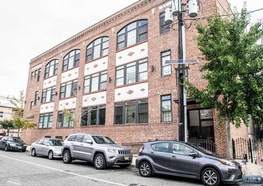 Beautifully maintained 2 bed, 2 bath, 3rd floor condo unit located in the Ironbound Section of Newark with so much to offer. This unit features plenty of natural light, high ceilings, beautiful crown molding, impeccable hardwood floors throughout all rooms except tiled kitchen and baths. Open floor plan perfect for entertaining in the kitchen and living room. Eat in kitchen with granite countertops. Amenities include intercom and elevator. Walking distance to bustling Ferry Street and easy access to major highways and public transportation (less than 2 miles to Newark's Penn Station with direct service to NYC). Unit also has one assigned ground level parking space along with a storage closet.