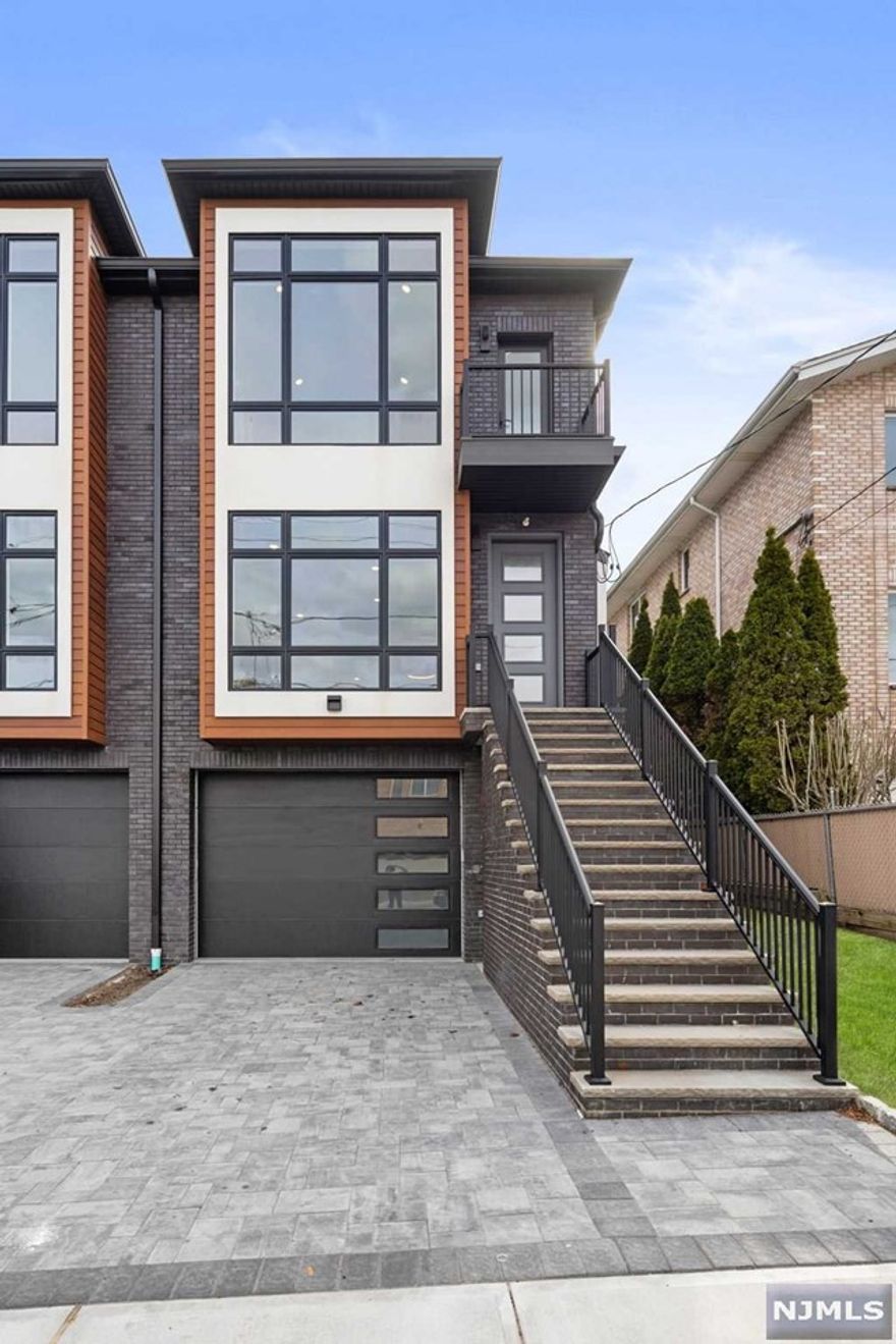 Contact Listing Agent Ryan D'Errico 201-988-4670 to see this New Construction townhouse with private rooftop terrace - Conveniently located steps from Anderson Ave downtown district and NYC Express Transportation. Walk to Shopping, Parks, and School, this home is centrally located in the most convenient neighborhood of town. Encompassing 4 levels of living space and approximately 3000SF, this home is an ideal choice for those seeking a spacious home close to New York City. Key features include: Open Layout, Quartz Countertop, Modern Finishes, Gas Fireplace, Attached Garage, Central Air, and 3 Private outdoor spaces including a Rooftop Terrace - A Modern Luxurious Home atop the Palisades in Cliffside Park. Come take a look!