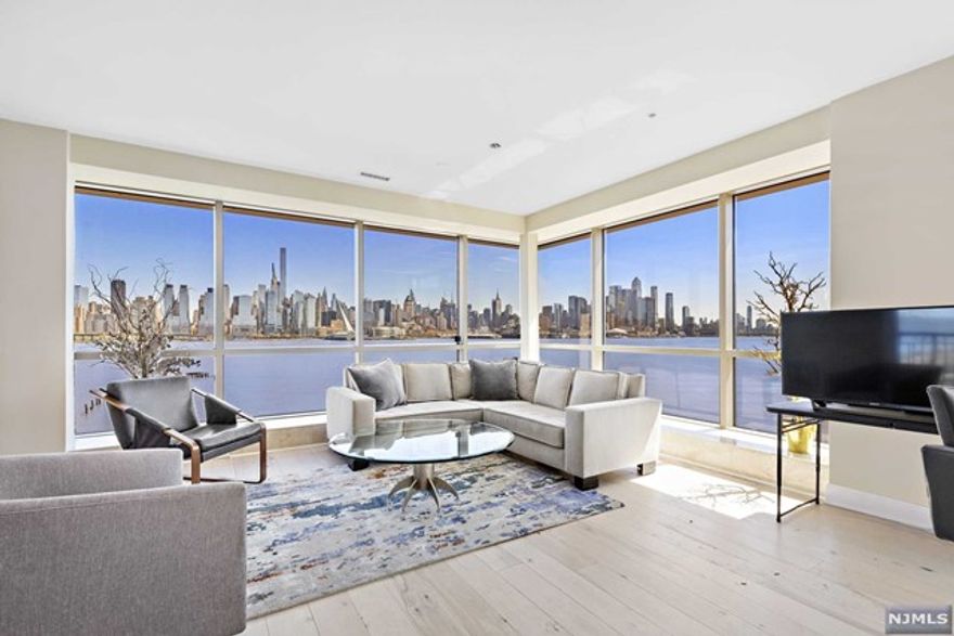 YES, this is your direct million dollar view! Large custom unit featuring 1626 SF in the sky Prepare to mesmerized as everyday is a vacation with this view! Originally designed as a 2 bedroom layout, this home was completely reconfigured pre-construction to an enormous, custom 1 bedroom 2 bath floorplan. The kitchen appliances have been upgraded to include a full-size Sub Zero glass door refrigerator, 2 integrated sub-zero refrigeration drawers, a Wolf electric cooktop with built-in remote control hidden downdraft ventilation, Wolf double oven as well as imported Italian cabinetry. The enormous master bedroom suite contains custom Mahogany floors, custom California closets, and a limestone master bath. The custom macadamia nut floors, in the main living space. A large balcony facing the beautiful river and skyline completes 1626 square feet