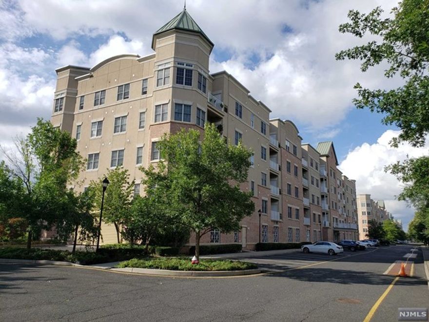 Beautiful Bright and Clean Unit Over Looking the Golf Course, 9 Ft Ceilings, Newer Wood Floors Throughout, Recessed Lights, Modern Open Kitchen with Granite Countertops, Maple Cabinets, Stainless Steel Appliances, Master Bedroom with Walk-in Closet, Master Bath with Tub and Seamless Glass Shower, Kholer Fixtures Throughout, Anderson Windows, Laundry in Unit, Terrace. One Garage Parking Included. Club House with Gym, Conv Located, Easy Commute to NYC, Near Shopping and Major Highways.