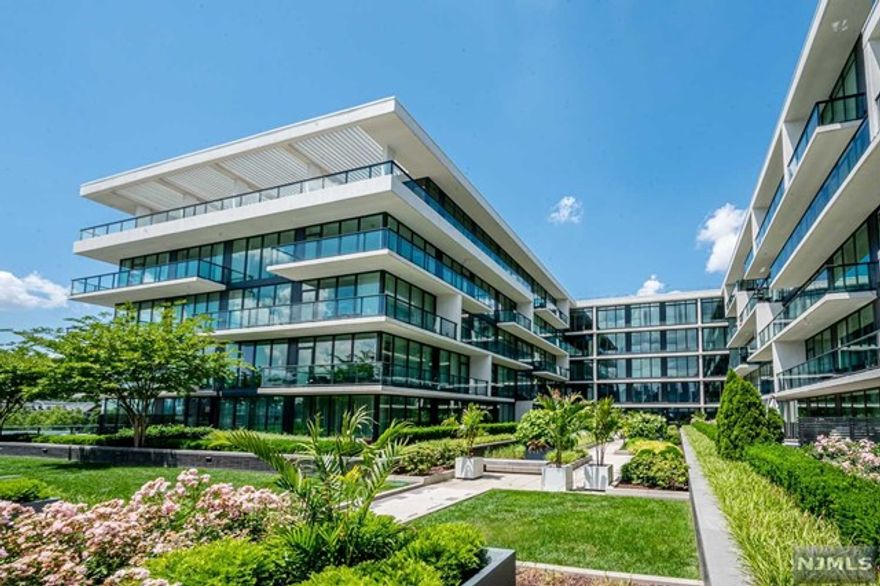 World-class living awaits you in this stunning 2 Bedroom / 3 Bathroom luxury home located in highly sought after Avenue Collection. Situated along the banks of the Hudson River and just steps from the NY Waterway Ferry, this home features only the finest finishes. Stretching across 1,566 SqFt, this sun drenched home features hardwood floors throughout, custom motorized window treatments, floor to ceiling windows, one car garage parking, and balcony stretching the length of the unit with direct NYC views. Chef's kitchen includes quartz countertops, custom cabinets, SS appliances, and breakfast bar with waterfall edge. This split floorpan includes living room, dining room / possible third bedroom, master bedroom with ensuite spa-like bathroom and walk-in closet, spacious guest bedroom with ensuite bathroom, and a third full bathroom. The Avenue Collection includes 24 hour concierge, fitness center, outdoor pool with cabana, children's playroom, movie theatre, sky lounge, and more!