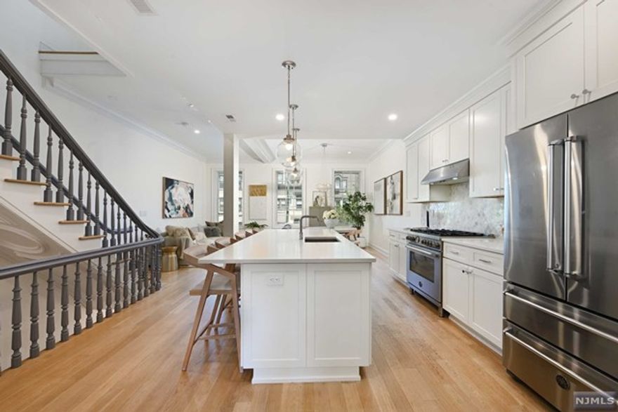 A beautiful modern classic offering the best in brownstone living. Located on Hudson Street, one of Hoboken's most coveted blocks, this fully gut-renovated 4 bed 3 bath duplex features 2,188 SF of sophisticated living inside and out. Flooded with natural light, this pristine home features wide plank oak floors, crown and base moldings, custom lighting and Pella windows throughout. The open living area is the perfect layout for dining and entertaining with a state-of-the-art custom kitchen featuring floor-to-ceiling cabinetry, high-end European appliances, marble backsplash, quartz counters, & expansive island. Currently occupied as a 3 bedroom plus convertible guest/rec room, with additional private office, this exceptional home has it all. The primary bedroom is en-suite, designed for your comfort with radiant heated bathroom floor, Carrera marble tile, Kohler fixtures, vanity with double sink, and walk-in closet. Additional bedrooms feature large customized closets and two full