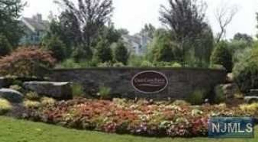 Exquisitely appointed luxury townhouse in Cross Cree Pointe offers two bedrooms and two and one half baths plus den. This fieldstone model is situated in the most desirable location with stunning Western views ,double height ceilings, large picture windows and new maple kitchen with granite countertops, double stainless steel sink, dishwasher and stainless steel refrigerator. First floor offers living room with fireplace and cathedral ceiling, dining room, modern eat in kitchen ,den which could be converted into a third bedroom and a powder room. Second floor offers master bedroom with master bath and walk in closet, second bedroom with full bath and laundry. Enjoy living at Cross Creek Pointe which offers gated entry, security, tennis courts and swimming pool close to transportation to NYC, shopping, houses of worship.