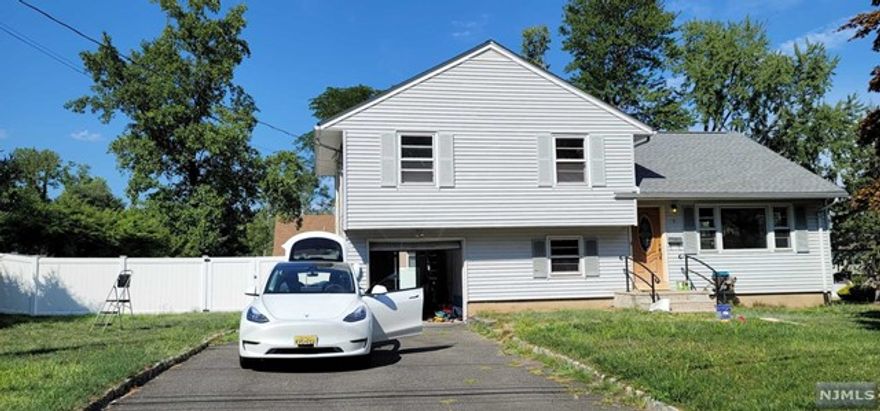 Don't miss this gorgeous & desirable Split/Level style home located on a very nice and finest street in Norwood . Classic split level in the beautiful town of Norwood! Sitting on just over 1/3 of an acre, this 3BR 2FB home has lovely wood floors throughout, a comfortable living room area, freshly updated kitchen with stainless appliances, under-cabinet lighting and a generous seating area. The 3BRs upstairs provide plenty of space and storage while the modern, updated FB has a heated towel rack and floor. Make your way to the den level and find the 2nd FB with similar modern updates, heated floor and towel rack. Also a walkout to the 1 car garage (with a Level 2 charger for EV charging). The basement level provides plenty of storage. Make your way outside from the kitchen to a refreshed deck, perfect for entertaining while taking in the large fenced-in backyard. Your new home is close to shopping, public transportation