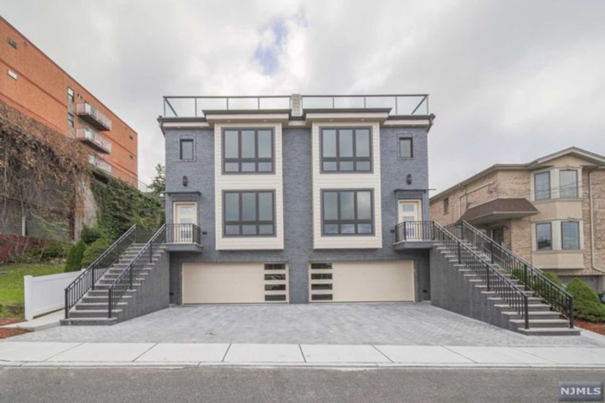 Panoramic view of the Meadowlands from roof deck!!! Brand new Modern townhome approximately 3,200 square feet located in East Hill area in Palisades Park built by Elite Homes Construction. Steps from NYC transportation, parks and schools. This townhome features 9 ft high ceiling on main level, Modern kitchen with top of the line stainless steel appliances, center island, quartz countertop, eating area looks out to large balcony. Second floor boasts two ample size bedrooms with full bathroom, master bath with soaking tub, oversize glass shower and with double vanity, central, central vac, oak hardwood floor. Laundry room on bedrooms level. Third floor with extra room and entrance to roof deck. Ground level complete with garage,Separate entrance.