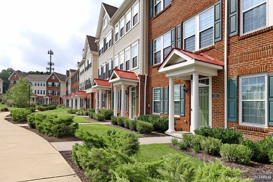 Charming Townhome in the Sought-After Crossings at Radburn Welcome to this inviting ground-floor townhome, where modern convenience meets timeless design.As you enter, a spacious office/den provides a perfect space for work or relaxation, complemented by two custom coat closets, a handy half bath, and direct access to your two-car garage. The main floor offers an open-concept living space, ideal for both everyday living and entertaining.The upgraded gourmet kitchen features stainless steel appliances, granite countertops, and a central island,all flowing seamlessly into the dining area with hardwood floors and a cozy balcony.A powder room completes this level,ensuring convenience for you and your guests.Upstairs,the master suite is a true retreat with two walk-in closets and an elegant master bath.Two additional bedrooms,a full bath,and a well-located laundry area provide everything you need for comfortable living.Located just 5 miles from bus and train access to NYC. A Must See!