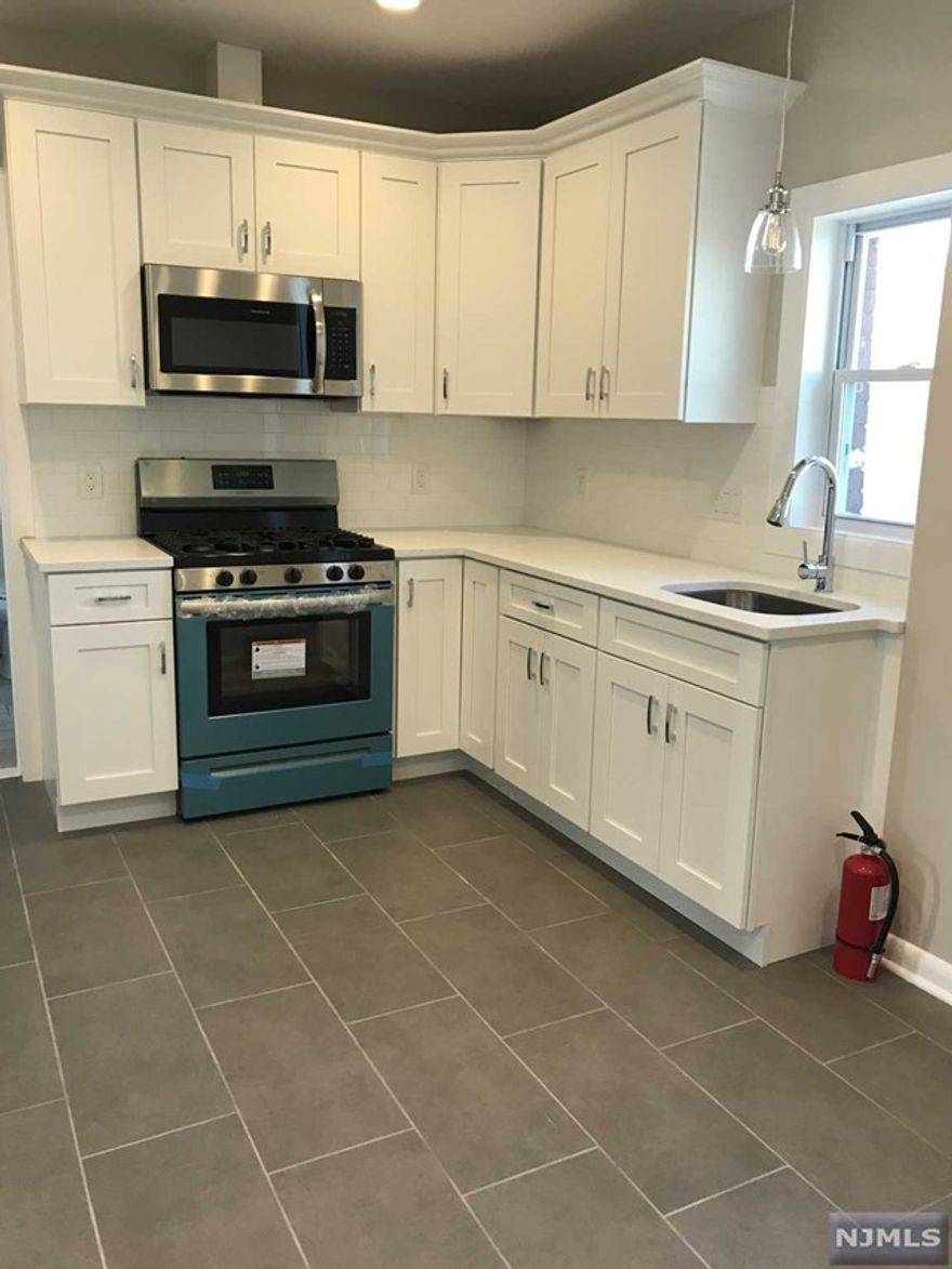 Updated 3rd floor apartment, featuring 2 bedrooms 1 full bath. New flooring throughout, brand new kitchen with fridge provided. Bedrooms complimented with spacious closets. Clean and pristine full bath with stack-able washer and dryer. Parking provided as well. Close proximity to public transportation, restaurants and shopping.