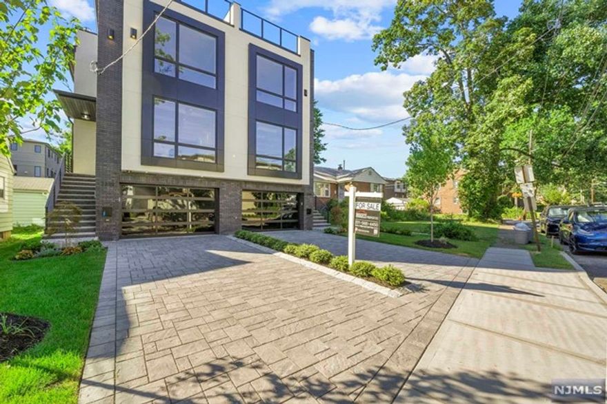 Welcome to 2241 Center Ave, highlighted by its sleek contemporary design and oversized Anderson windows...This townhome offers a bright and airy open concept with incredible private roof-top terrace and yard, giving you the much-sought after oasis. Carefully selected details w/ Oak hardwood flooring, Porcelain tiles, Kohler fixtures, LED lighting, and custom Moldings....Main Level boasts 9ft ceilings, Modern Kitchen with Quartz countertops, backsplash, GE Cafe stainless-steel appliances, and custom flat-panel kitchen cabinets...Primary Suite with multiple closets and spa like bath w/ double vanity, oversized shower w/ body jets and rain head, and tub. Roof-top terrace offers lounge with wine cellar and full wet bar upstairs Fridge, Sink, and Gas Grill. Ground level with Garage, Recreation Room, Office, Full Bath, and sliding door to yard...