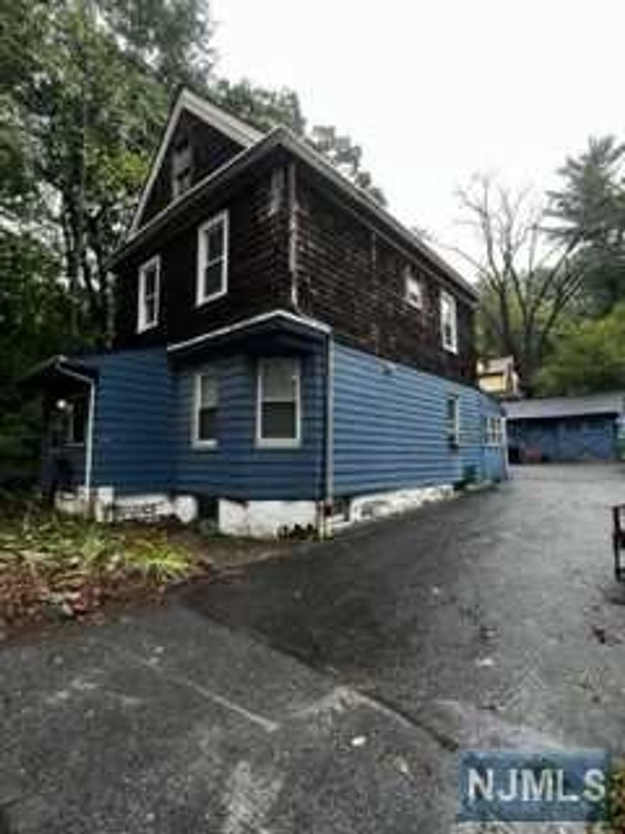 This home is situated on a large lot with lots of outdoor space. It has a large Bedroom suite on the 1st Floor, plus a Primary Bedroom and two other Bedrooms on the 2nd Floor, along with another full bathroom. The large dining room and living room allow for comfortable use of this space. Attic and basement space may be used for storage.