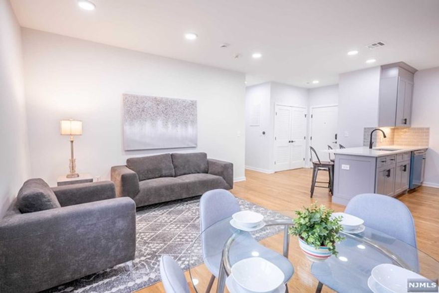 Presenting an exquisite condominium on Bloomfield Ave with over 1000 sq. ft. of space blending comfort and functionality. The modern interior sets the tone as soon as you enter. The open-concept living area flows from the living room to a sleek kitchen, perfect for both relaxing and entertaining. The kitchen features top-tier appliances, stylish cabinetry, and ample countertops.Two spacious bedrooms offer tranquility.The primary includes an en-suite bath for a serene retreat. The second bedroom is versatile for guests, office, or personal use. Both baths have contemporary fixtures for a spa-like feel. Large windows flood the space with natural light.With transportation nearby, commuting to Manhattan or NJ is a breeze.Don't miss your chance to own urban luxury.This home qualifies for CCM Community Promise loan products with down payment assistance.