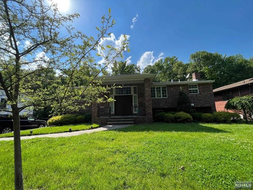 This B/L features a private back yard which backs up to the Nature Center. marble floors span throughout the entry foyer, stairs, living room, dining room and hallway. The living room is enhanced with a bright bay window & cathedral ceiling, the dining room is open with a window & Bright, the eik kitchen is updated with granite counter tops, with an additional side entry door to the back yard. This home also features newer baths with marble floors and counter tops. The lower level of this home includes ceramic tile floor in family room with laundry room area and utility room. Closets complete this well maintained home.