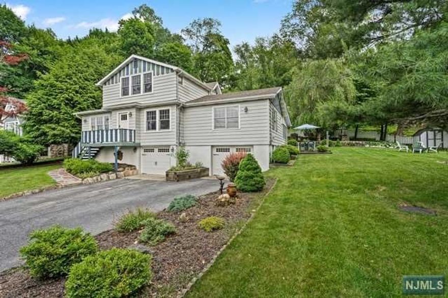 CLASSIC CRANE CHARM COMBINED WITH A GORGEOUS RENOVATION WITH MODERN FINISHES THROUGHOUT! This SHORT TERM RENTAL sleeps seven comfortably and offers everything you would need to feel like you are living in your full time residence. The living room boasts a cathedral ceiling, Pecky Cypress ceilings and walls, a picture window overlooking the lake and a stone wood burning fireplace. A chef's kitchen can be seen in the distance & has bright white cabinets, gold hardware, center island, breakfast bar, SS appliances and a skylight. Spacious formal dining room with lake views, a large yet cozy den, awesome three season screened room, a laundry room, large first level bedroom (with desk) and a marble full bath across the hall, two en suite bedrooms with marble baths upstairs + more. NEW patio, gardens, stone fireplace, gas BBQ and large yard. Don't miss this great opportunity to live in Lake Mohawk only approx. 50 miles from NY! Beautiful golf courses & tennis nearby! Streaming services