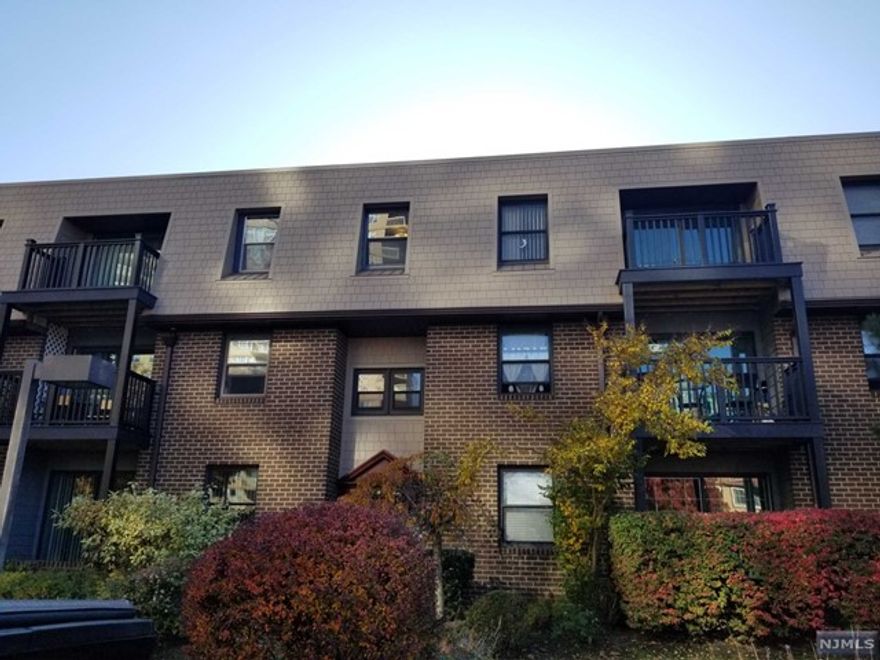 Totally renovated large one bedroom on 1st floor. This is a great unit with fireplace, washer dryer, 2 parking spots and a private storage room. Do not miss - this spacious unit has pergo floors throughout- lots of closets and patio. Close to all!! Must be owner occupied for two years.