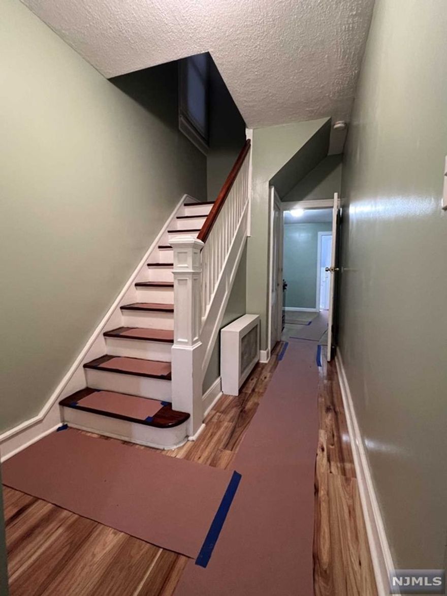 We invite you to explore this well-appointed 4-bedroom, 3-bathroom home situated in a highly convenient location. Upon entry, you'll be greeted by a welcoming foyer that leads into the residence. The interior boasts elegant new flooring throughout. The first floor features a kitchen, a dining room, a spacious living room, a master bedroom, and a fully updated bathroom. The living room is awash with natural light, providing ample space suitable for large families. The master bedroom includes two closets and comfortably accommodates a king-size bed.On the second floor, you will find three additional bedrooms and a full bathroom equipped with a stand-up shower. Parking is available for an extra fee. This home enjoys a prime location near the Lincoln Tunnel, with easy access to public transportation to New York City, as well as proximity to various restaurants, supermarkets, schools, laundromats, and parks. We encourage you to call and schedule your appointment today.