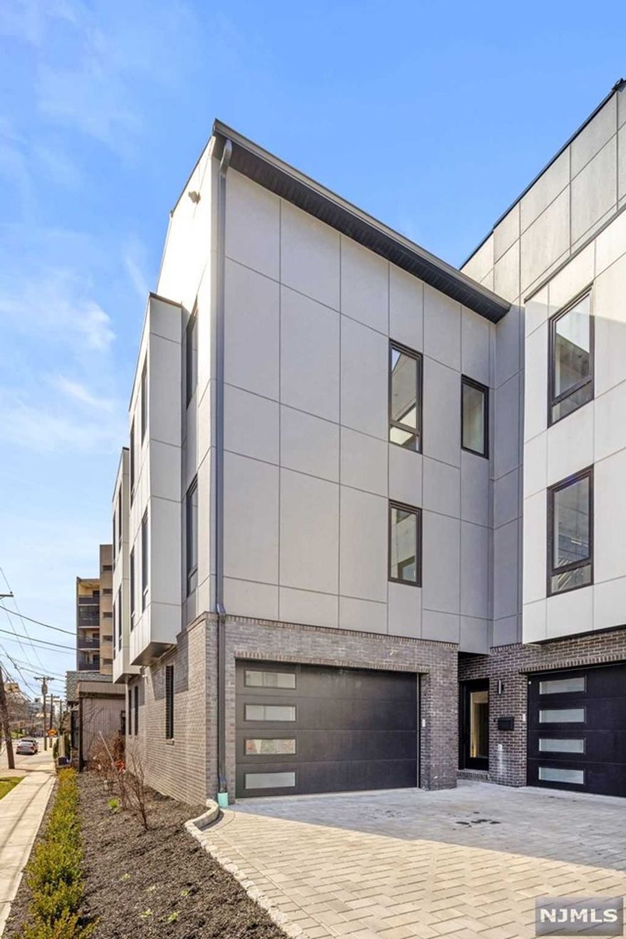 Contact Listing Agent Ryan D'Errico +201-988-4670 for a private tour of this Amazing End Unit. Exclusive collection of sophisticated townhomes in Cliffside. Developed by Premier Developers and styled by VDA design. This unit showcases an upscale kitchen featuring quartz countertops and a Bosch appliance package. The well-designed living room/dining room area boasts a gas fireplace and powder room. The primary suite includes a spa-inspired primary bathroom, accompanied by 2 additional bedrooms and a full bathroom. Top Level expansive rooftop terrace and finished loft room with wet bar. The ground level provides a recreation room, half bath, and attached garage + 1 outdoor spot. Additional highlights comprise recessed LED lighting, oak floors, high-efficiency boiler, multi-zone heating and Central A/C. Situated near Anderson Avenue downtown district and offering convenient access to NYC via ferry or express transportation. Come for a tour!