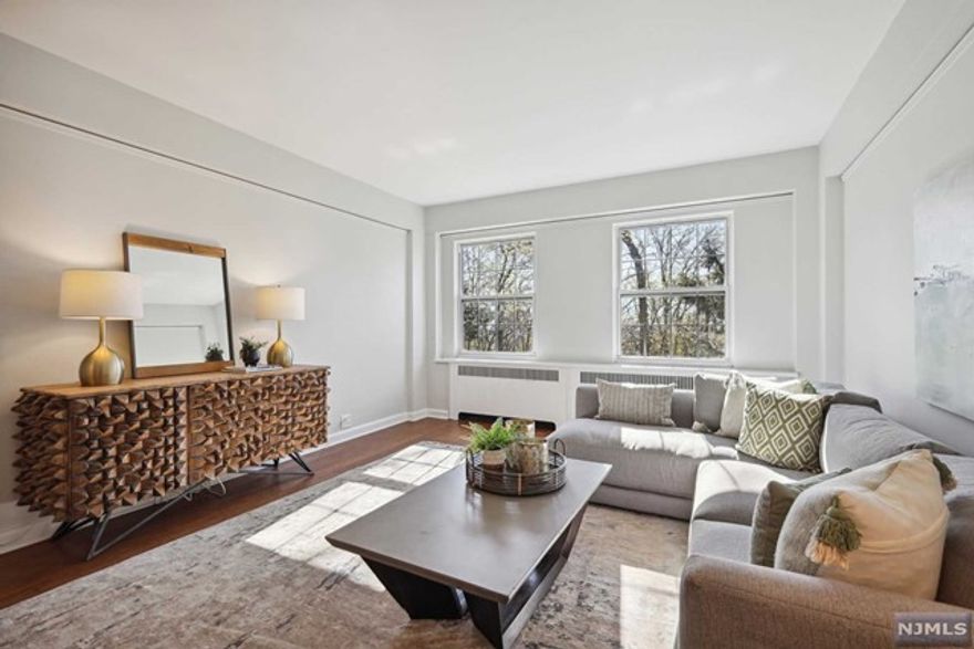 Chic and Comfy! This renovated one-bedroom co-op at The Rockcliffe is a fabulous space with a new chef's kitchen, new floors, high ceilings, classic picture moldings, stylish new light fixtures, and freshly painted interiors. The building is in a park-like setting, close to downtown Montclair, with shopping, restaurants, an Art Museum, a movie theater & NYC transportation. Parking outside $35, garage space $60 assigned (if avail). The monthly fee of $1,195.12 includes heat, hot water, gas, sewer, trash, 24-hour concierge, on-site super, maintenance of common areas, and property taxes. The fee is 37% tax deductible. Unit 1H has 360 shares. Building allows two cats maximum or a prescribed therapeutic/med/support dog.