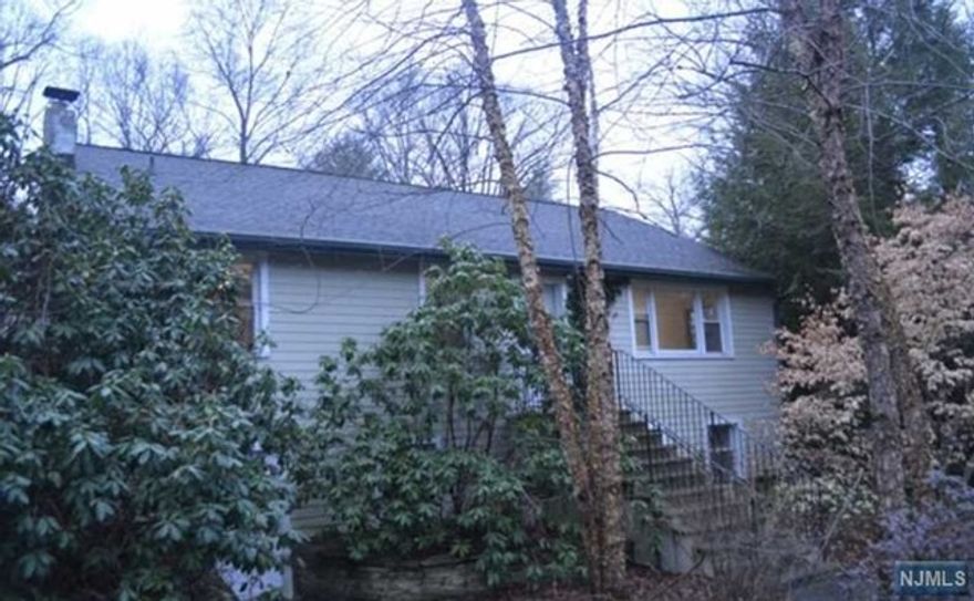 Envision yourself in this spacious 2254 sq ft ranch, recently painted, with updated floors! Enter into the hardwood floored oversized living room. Steps away are two bedrooms with ample closet space along with a full bath. The master bedroom has a slider door to walk out onto the patio and enjoy the backyard. The updated kitchen with walls of custom cabinets, high end appliances, copper sink and granite tops leads to the sunlit, open and airy breakfast nook with sliders on either side of the room. The large open basement is accessible from ground level with two separate doors. A laundry room and full bath complete the lower level. Shared driveway with commercial property in the back. Be part of Ringwood today!