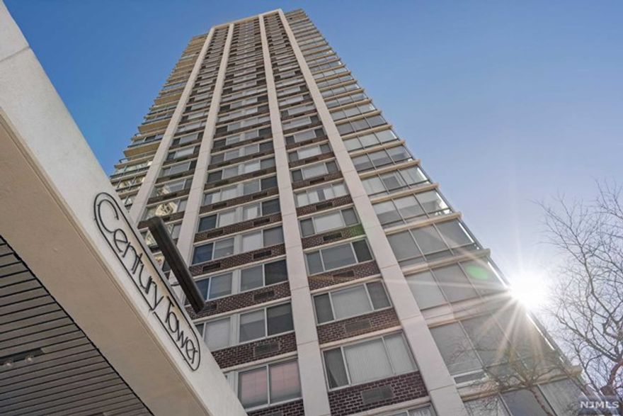 Motivated seller! Great opportunity for the largest (approx. 1299 sq. ft) one bedroom, one and a half bath line in one of Fort Lee's best buildings. This desirable 'L" shaped living room and den affords an easy conversion to either a full two bedroom, a home office or a formal dining room. Magnificent sunset views can be appreciated from the terrace and oversized picture windows throughout. Century Tower is a premier luxury building with a full range of amenities, including 24-hr doorman and concierge, outdoor pool, fitness center, community room, kid's playroom, BBQs and much more. Fabulous location near good schools, Houses of Worship, restaurants, shopping and easy transportation to NYC. Parking $90. Subject to Board Approval.