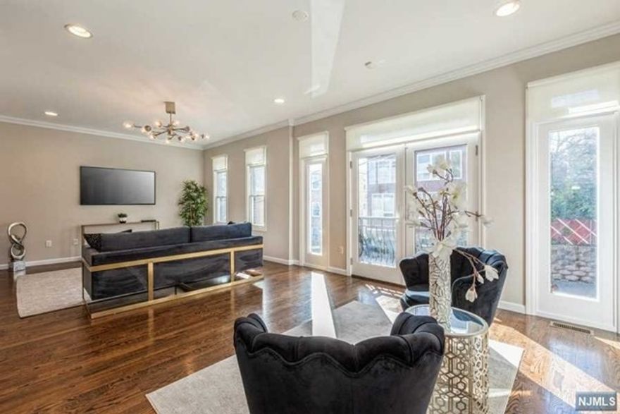 CUSTOM BUILT !!! APPROXIMATELY 3095 SQFTB WITH 3 BDR, 3.5 BATH. ALL BRICK TOWNHOUSE IN NJ GOLD COAST. OPEN FLOOR PLAN, HIGH CEILINGS AND LARGE WINDOWS MAKE THIS UNIT VERY SUNNY AND BRIGHT. MODERN KITCHEN WITH GRANITE COUNTERTOPS, BACKSPLASH, AND STAINLESS STEEL APPLIANCES, LEADS YOU TO A DECK AND PRIVATE BACKYARD. FROM THE DECK YOU HAVE SEASONAL HUDSON RIVER AND GWB VIEWS. SPACIOUS MAIN BR WITH CUSTOM BATH AND WALK-IN CLOSET. ADDITIONAL 2 SPACIOUS BR WITH CUSTOM DESIGN CLOSETS COMPLETE THE 2ND FL. 3RD FL HAS VERY LARGE EXTRA LIVING SPACE THAT CAN BE UTILIZED AS OFFICE/GYM/BR OR FAMILY RM. FULLY FINISHED LOWER LEVEL WITH ADDITIONAL FULL BATH, LAUNDRY RM, AND A LARGE ROOM THAT COULD BE USED AS HOME THEATER OR KIDS PLAYROOM. CLOSED TO NYC TRANSP, SHOPPINGS, GWB, SCHOOLS. DON'T MISS THIS GREAT UNIT!!!