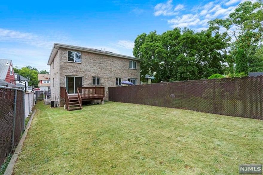 Bright and sunny well-maintained 3 bedroom 3.5 bath duplex, 2 mins walk to Broad Ave and NYC buses. Deep 25x125 lot with fenced-in backyard. First floor features an open floor plan that connects to the dining room. The sun-filled eat-in kitchen with granite countertops leads you to updated deck and fenced in back yard, perfect for grilling and bbqs. Second floor features an oversized master bedroom with master bath and triple closets. Two additional bedrooms and additional full bath complete the 2nd floor. Fully finished basement with laundry, full bath and separate side door entrance. Deep one car garage with room for 2 additional cars in the driveway. Come visit to make this home yours!