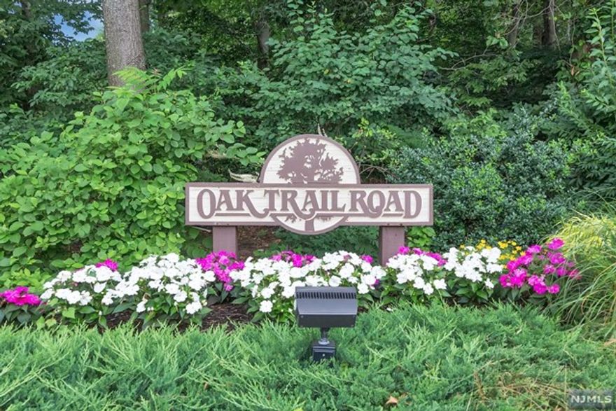 RARE OPPORTUNITY TO OWN A PREMIER TOWNHOME IN THE GATED COMMUNITY OF OAK TRAIL. LARGE AND COVETED END UNIT WITH IT'S OWN DRIVEWAY ALLOWS FOR AMPLE PARKING, FEATURES 4 BEDROOMS, 3 FULL AND ONE HALF BATH WITH A WALKOUT LOWER LEVEL. LARGE TWO-STORY ENTRANCE FOYER OPENING TO AN OVERSIZED LIVING ROOM & FORMAL DINING ROOM WITH ACCESS TO AN EXPANSIVE DECK OVERLOOKS A PRIVATE AND PARKLIKE SETTING. SPACIOUS RENOVATED EAT-IN KITCHEN IS OPEN TO THE LIVING ROOM & FORMAL DINING ROOM, POWDER ROOM, PANTRY AND TWO-CAR GARAGE COMPLETE THIS LEVEL. THE SECOND FLOOR OFFERS A LARGE PRIMARY SUITE WITH A FIREPLACE, UPDATED BATH, TWO ADDITIONAL BEDROOMS, FULL BATHROOM AND LAUNDRY ROOM. HARDWOOD FLOORS THROUGHOUT THE FIRST AND SECOND LEVEL. SPACIOUS, WALKOUT LOWER LEVEL FEATURING A FAMILY RM, BEDROOM, FULL BATH AND LOTS OF STORAGE. BEAUTIFUL GROUNDS, OUTDOOR POOL AND METICULOUSLY MAINTAINED COMMUNITY. CLOSE TO SHOPPING, HOUSES OF WORSHIP & EASY COMMUTE TO MANHATTAN! OAK TRAIL IS A PET FRIENDLY COMMUNITY.