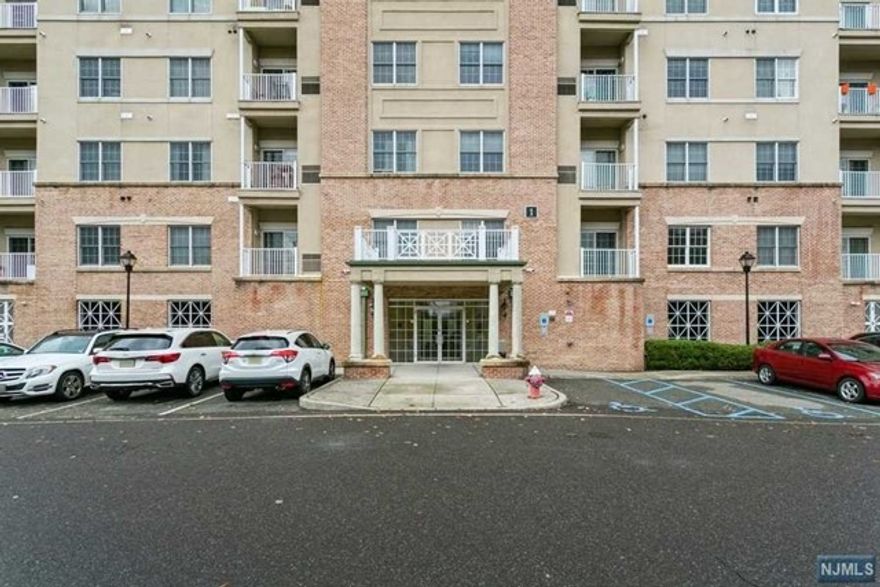 Beautifully upgraded two bedroom/two bath, end-unit in Englewood's sought-after Windsor Park Condos featuring 1,288 sqft of luxury living. One of a kind, corner unit with gorgeous golf course view. New porcelain foyer, dramatic 12' ceilings, luxury hardwood plank floors and open layout, make this unit a MUST SEE! Top of the line, stainless steel kitchen appliances, including new Miele dishwasher. New washer and dryer in unit. Lavish primary suite features marble double sink, tub and separate shower. Windsor Park club house boasts state-of-the-art gym, game room, entertaining area, fireplace & kitchen facilities. This is a pet friendly complex and just minutes from GWB & NYC. Includes assigned cover parking space.