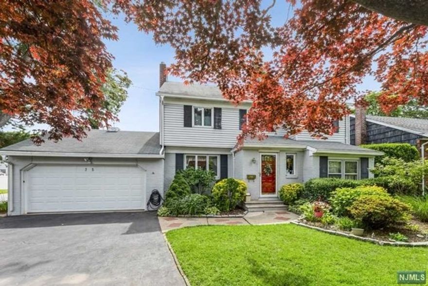 Picture perfect colonial in prime Bergenfield location near Teaneck border. This is an amazing bright home on a large corner property. First floor with Living Room with glass French doors out to the deck and backyard, modern kitchen, dining room opens to large family room, as well as full bathroom and bedroom. Second floor features 4 large bedrooms and a full bathroom. 2 separate basements, one from the original house with utilities and small rec room and storage and second basement under the family room with large rec room. Gorgeous private fenced in backyard with large deck. 2 car attached garage with a driveway for 4-6 cars.