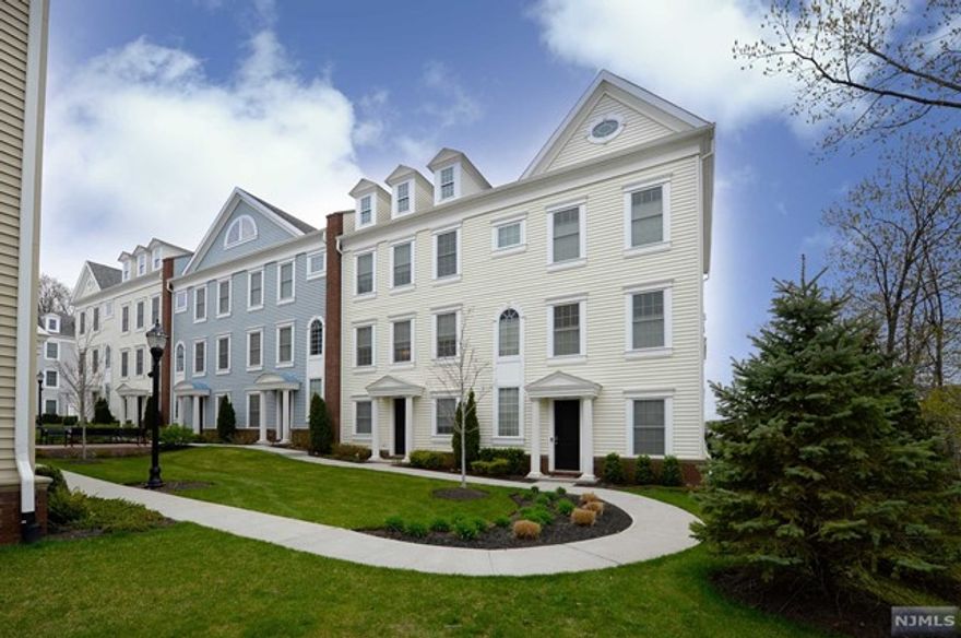 Stunning Townhome located in Wright Place in the town Woodridge . This impeccable home showcases 4 bed 3.5 bath, 2258 square ft of living space, balcony, 2 car garage, & designer finishes throughout. This light and airy home has light pouring in from every angle! Come home and be greeted by high ceilings, bed/ full bath on the first floor, upgraded flooring, gourmet kitchen with upgraded features, laundry on top floor, beautiful light fixtures and much more. Close to trains , parks, schools and shopping right at your fingertips!