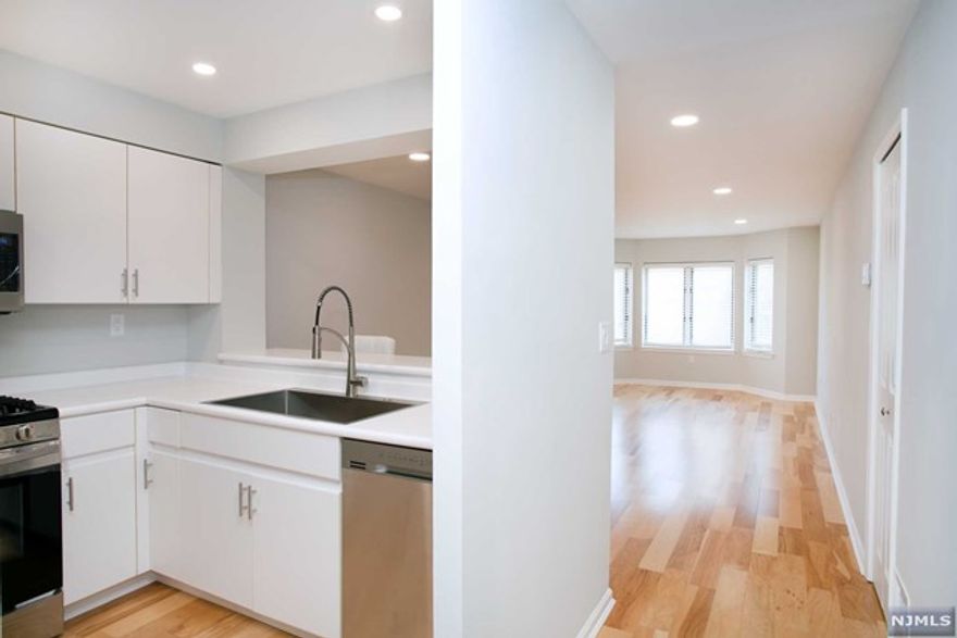 Welcome to Independence Harbor, a luxurious waterfront community in the heart of Edgewater. This beautiful condo has been thoughtfully updated to offer a contemporary living experience. Features a modern kitchen with stainless steel appliances, wood floors throughout, elegant new bathroom, private laundry, new lighting, and much more! This premium community offers resort style amenities including fitness center, swimming pool, tennis courts, and clubhouse. The Hudson River waterfront promenade offers a serene escape with captivating views. Edgewater's vibrant dining and shopping scene awaits just beyond your doorstep. The prime location also makes commuting to Manhattan a breeze with bus and ferry services. One reserved covered parking space is included. For guests, ample parking is available, and the community offers EV charging stations. Don't miss this incredible opportunity to make Independence Harbor home!