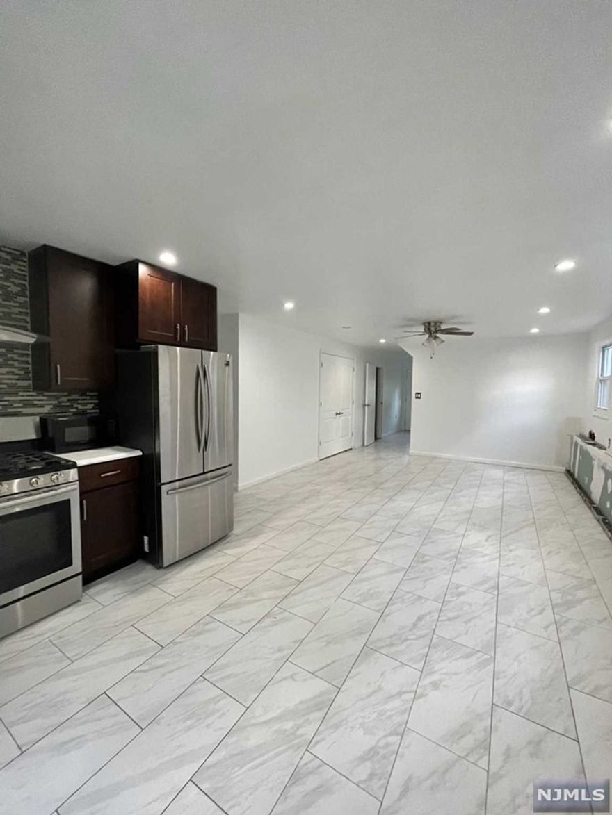 2 bedroom 1 bath fully renovated ground floor apartment with open style kitchen/living room. Laundry included as well as all gas, electric and heat utilities are all INCLUDED in the rent. The perfect money saver! Street Parking only. NO PETS.