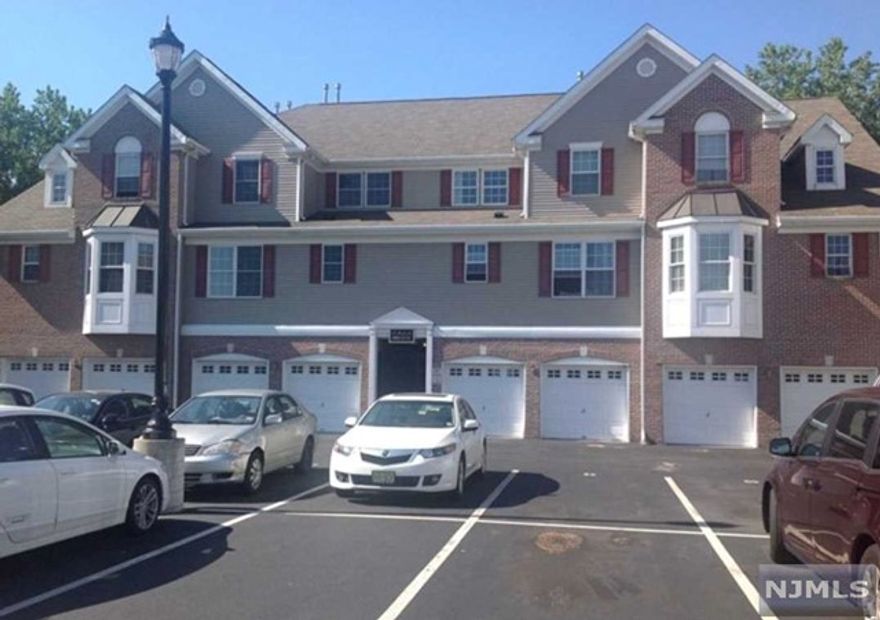 Welcome to this spacious and contemporary townhouse, offering over 1,500 square feet of stylish living space. With two large bedrooms and 2.5 bathrooms, this home provides the perfect blend of comfort and functionality. The elegant hardwood floors extend throughout the residence, creating a warm and inviting atmosphere. Natural light floods the home, highlighting its bright and sunny interiors all day long. The gourmet kitchen is a culinary enthusiast's dream, featuring high-end appliances and sophisticated finishes. Located in a tranquil and quiet community, this property ensures a peaceful living environment. For your convenience, the townhouse includes a one-car garage and an additional outside parking space. Enjoy easy access to major highways and a short walk to NYC transportation, making commuting a breeze.