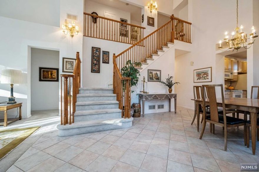 Lovely townhouse with Expansive Master Bedroom suite on first floor with walk in closet. Master bathroom includes double vanity, tub shower and jetted tub. Tile floor in entryway and through to Kitchen. High ceilings in charming eat-in Kitchen area. Living / Dining room combo with cathedral ceilings open to view second floor. Gas fireplace in living room. Sliding doors to deck. First floor half bathroom. Washer/Dryer on first floor. Second floor has 2 bedrooms and Full Bathroom with double vanity and tub/shower combo. Condo Association has pool and tennis. Maintenance covers lawncare, snow removal, Maintenace of pool and courts.