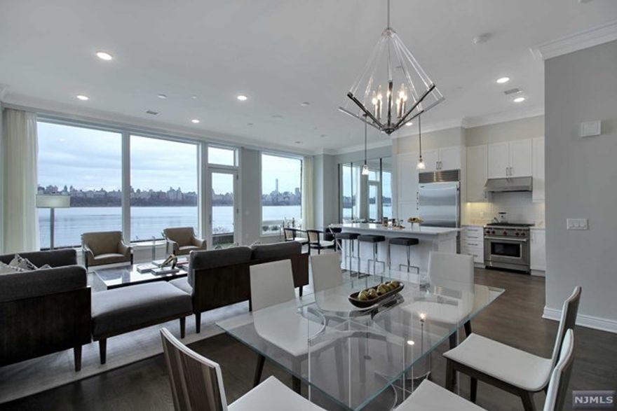 The Glass House features an exclusive Townhome Collection at Edgewater Harbor. Only fifteen of these two-story homes constructed, the utmost attention was given to every element of design, creating homes that are timeless epitomes of elegance. Upon entry, you are greeted with breathtaking views of the Hudson River and the NYC skyline, perfectly framed by oversized windows. An abundance of natural light brightens the spacious living area and gourmet kitchen, which opens onto a private terrace. Each of the residences has spacious balconies, large oversized Marvin windows, 10ft ceilings, gourmet kitchens, including Subzero, Wolf & Bosch stainless steel appliances, Caesar stone countertops, and premium Kohler fixtures, a spa-like bathroom with soaking tub. NEST Smart Home Thermostat System and Comelit Intercom System. Amenities include a Manhattan-facing outdoor swimming pool, deck and courtyard, rooftop deck, fitness center, media room and children's playroom