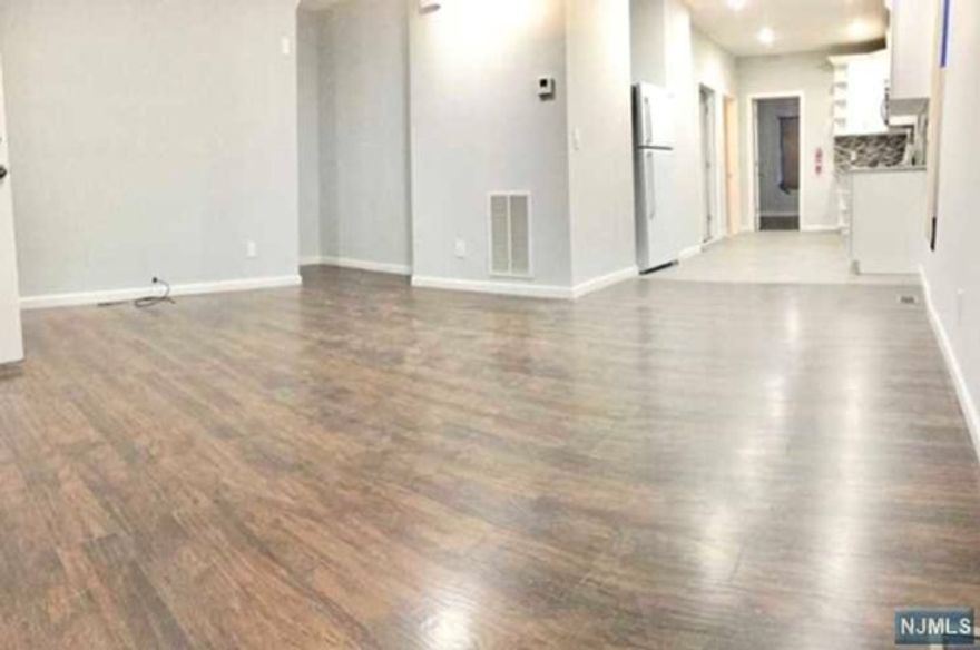 Welcome Home- to this beautifully newly renovated Multi family 1st floor Apt. Landlord provides water along with maintenance for lawn care/snow removal/appliances! The first floor includes: eat in kitchen, formal living room, formal dining room, 2 bedrooms, and full bath. All appliances are brand new: refrigerator, dishwasher, gas stove, microwave. Available street parking. Small pet is ok. Other pets are conditional. Local attractions include: Irvington Park with Soccer field, pond, kid park, softball, etc... Short ride to Maplewood country Club, South Orange Village. Plenty of multi-cultural eateries and grocery close by.