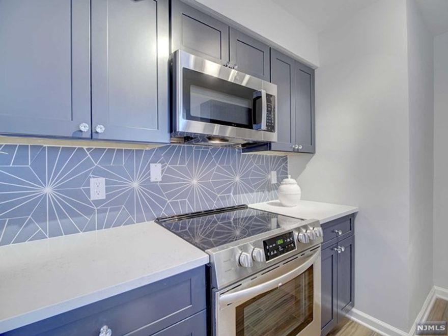 Come Home to this gorgeous gut renovated 19th floor 2 bedroom, 1 bath CO-OP. East facing, this newly done unit in a luxury high rise has a beautiful new kitchen with Bosch appliances, new bath, and generous sized bedrooms and beautiful natural dark floors. This popular Coop features a 24 concierge, included utilities (electric, heat, hot water), underground parking ($60/mo), comp jitney to the NYC train and grocery stores, a backyard mature "secret garden", first floor gym and bright, clean basement laundry. Just blocks from access to GSP and Route 280, this is one of the best NYC views in Essex County! Coop board approval required and 20% down payment is a requirement. Owner occupied. Ownership shares - 320. Monthly maintenance $1373. HOA includes taxes, maintenance and all utilities. No balcony. See details on entrance requirements and move-in fees (low closing costs).