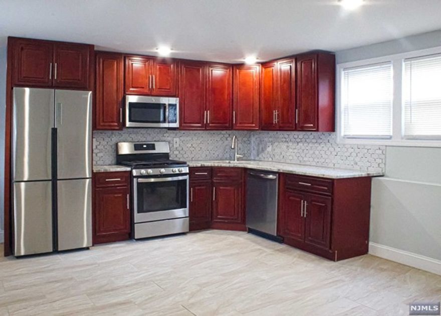 Beautiful newly renovated apartment located in Union City, NJ. 1st floor of 2 family home with 3 bedrooms 1.5 baths Completely renovated renovated kitchen and baths Stainless steel appliances included: refrigerator, stove, microwave and dishwasher Washer and dryer Within close proximity to New York City, near major highways (Route 78, NJ turnpike, Route 280 and Route 9). 10 minute drive to Lincoln Tunnel, 15 minute drive to Holland Tunnel. 20 min drive to Newark Liberty International Airport (EWR) Within walking distance to amenities, parks, shopping, grocery stores and private schools New Jersey Transit bus and trains to NYC and Near Stevens Institute of Technology Private backyard On street parking No smoking No pets Tenant pays for heat, gas and electric Landlord pays for water, sewer and trash removal Minimum 1 year Lease Agreement 1 1/2 month security deposit Credit check, background check and employment verification Available Immediately