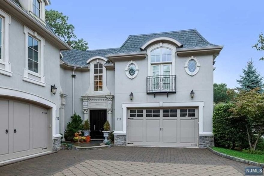 The most desirable townhome at exclusive Bellaire. Location, Location, Location!! 711 Bellaire has a private walkout lower level to a sprawling backyard abut the Alpine Country Club. As you enter the home you can see the picturesque views. The interior features include gourmet kitchen, specimen hardwood floors, raised patio, custom designed office, elevator, 3 fireplaces, large master suite, bedrooms on every level, home theatre and custom bar. This is the Bellaire unit that must be seen!!