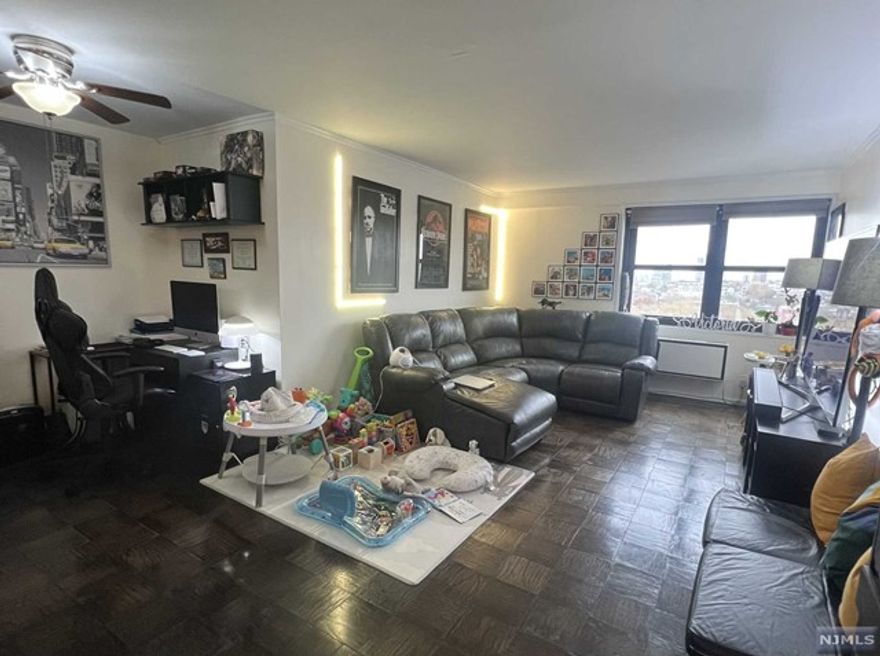 Unbeatable Value. Highly desired south-facing 1BR residence with views of the NYC skyline and Hudson River from the living room and bedroom. This spacious 781 sq ft condo offers an open floor plan designed for seamless entertaining, equipped with Bosch stainless steel appliances and a gourmet sink. The entryway and kitchen are beautifully tiled, while hardwood floors and crown moldings adorn the other rooms. Ample closet space is a plus! The Parker Imperial offers a wide array of amenities, including 24h doormen, pool, tennis court, gym with sauna, convenient laundry facilities on every floor, and one designated parking space. This building is located at a prime location adjacent to the sprawling James Braddock Park, a 167-acre oasis replete with tennis courts, ball fields, jogging and walking trails, and lake. Enjoy seamless access to NYC via bus and ferry options, along with vibrant dining and shopping. This is more than a residence, it's a way of life!