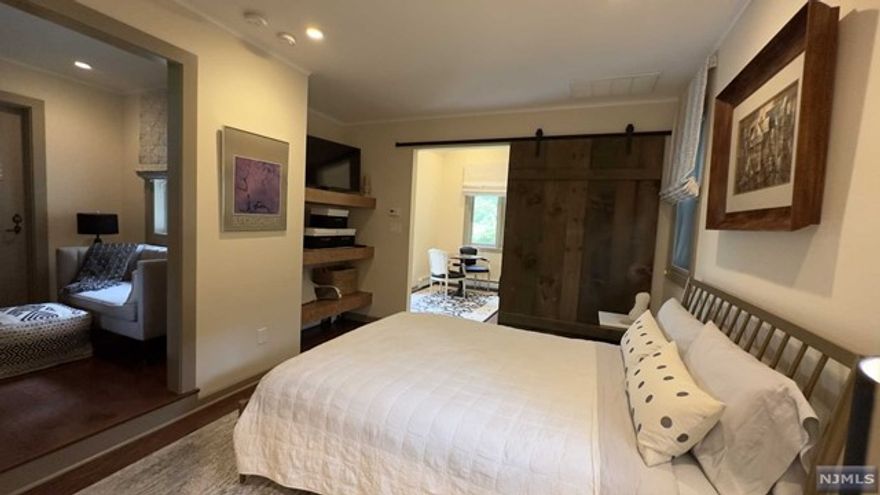 Modern styled fully furnished 1 bedroom/studio private apartment with all utulities included, including cable and internet. Located on a private dead-end street on South Mountain Reservation. Unit has a private entrance that opens up to a beautiful foyer with a seating area and TV which leads to a large stylishly furnished bedroom with amazing finishes. Full bathroom with heated floors. Beautiful barnyard doors in the bedroom open up to an office/den area with views of a beautiful backyard and private deck. Please note this unit has NO KITCHEN, area with Keurig, tea kettle, microwave and a small refrigerator provided. Owner lives on premise.