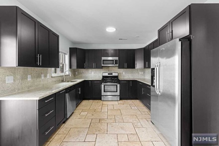 Stunning 3BR/2.5BA duplex townhome with a private terrace situated west-southwest of Downtown and Liberty State Park in Jersey City's most dynamic neighborhood, Bergen-Lafayette. This spacious home is located minutes away from the Liberty State Park light rail station which is only 4 stops to the Exchange Place path train which gets you to Manhattan in approximately 3 minutes. Interior features include two levels of vast open floor plan living including a renovated kitchen with custom cabinetry, granite countertops, backsplash, stainless steel appliances with gas range cooking, hardwood floors throughout, washer/dryer in unit, recessed lighting, great closet space and terrace!You'll love the convenience of having your own private entrance and two terraces and on-site parking for additional $150/month additional. Pet friendly home with fee. Save upfront cost of 1.5 months rent by subscribing to Rhino Insurance. Available now! Photos of similar unit.