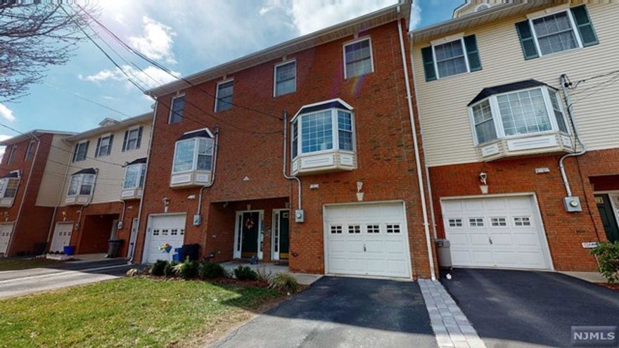 Built in 2006, this home just professionally painted from top to bottom offers 3 levels of townhome living with wood floors & high ceilings throughout. 1st floor includes a spacious foyer w coat closet, direct garage access, laundry, and a massive family room w a full bath which can be used as a 2nd primary suite along w sliders leading to the patio and open greenspace. The second floor boasts a beautiful open concept floor plan with a perfect eat in kitchen including newer SS appliances, a center island, lovely granite countertops, walk-in pantry & windows! This leads to the powder room, open dining room & large sunlit living room with a beautiful bay window & double sided gas FP. On the 3rd floor you'll find a generously sized primary suite with a full bath: soaking tub, shower, dual sinks, walk in closet and 2 more closets! An additional full bath and 2 more generous sized bedrooms complete this level. Smart home features included. Dual zone. Quick & Easy commute to NYC.