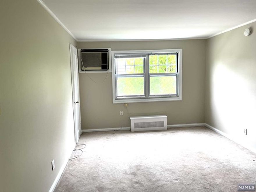 Lovely 2nd floor freshly painted one bedroom garden apartment which is also a short walk to NJ Transit buses, Memorial field and all major highways. This unit offers: a living room, one bedroom, a kitchen and one full bath. The monthly rent includes heat, hot & cold water, parking, recycling, and common area which includes a beautiful outdoor paver patio with barbecues in the rear of the unit. Laundry and additional storage is onsite.