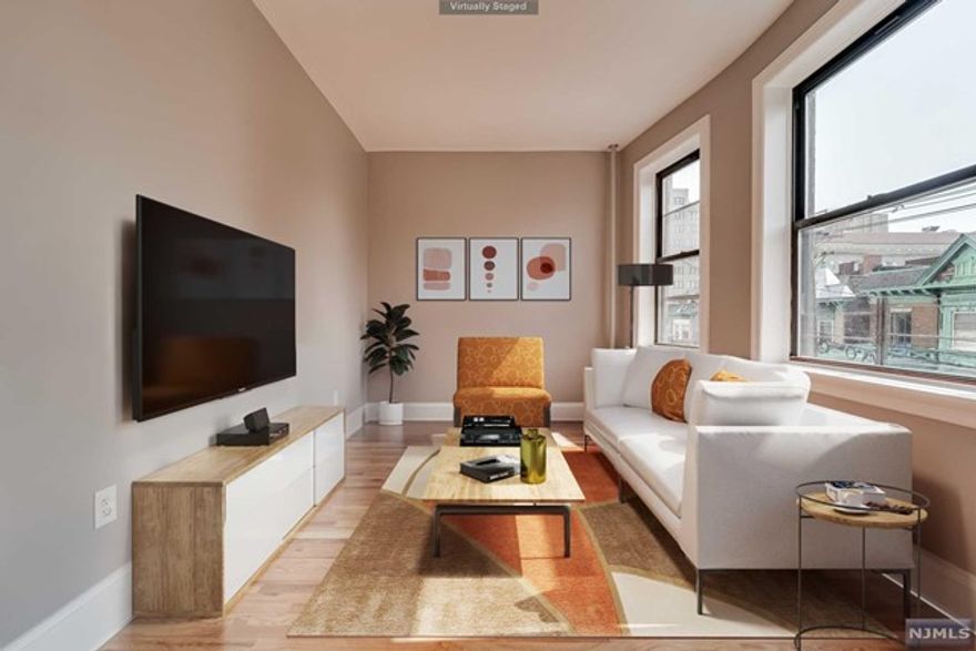 Gorgeously renovated and bright, 3 bedroom 1 bath apartment in Journal Square. This second floor 1,000sf beauty has everything you need to call home, stainless steel appliances: gas range, microwave, dishwasher & fridge, boasting high ceilings, stylishly designed bathroom and hardwood floors throughout. Washer/dryer in basement (wifi enabled) and shared outdoor space. Landlord pays heat and hot water. Tenants pay electric & cooking gas. Easy access to JSQ PATH, direct shuttle to Grove St PATH located next door at The Beacon. Citibike dock around the corner. Close to cafe's, shops, dining, schools, houses of worship and all major highways. Come see this one before it's gone. Tenant pays 1/2 fee. Cats accepted no dogs. NO PARKING.