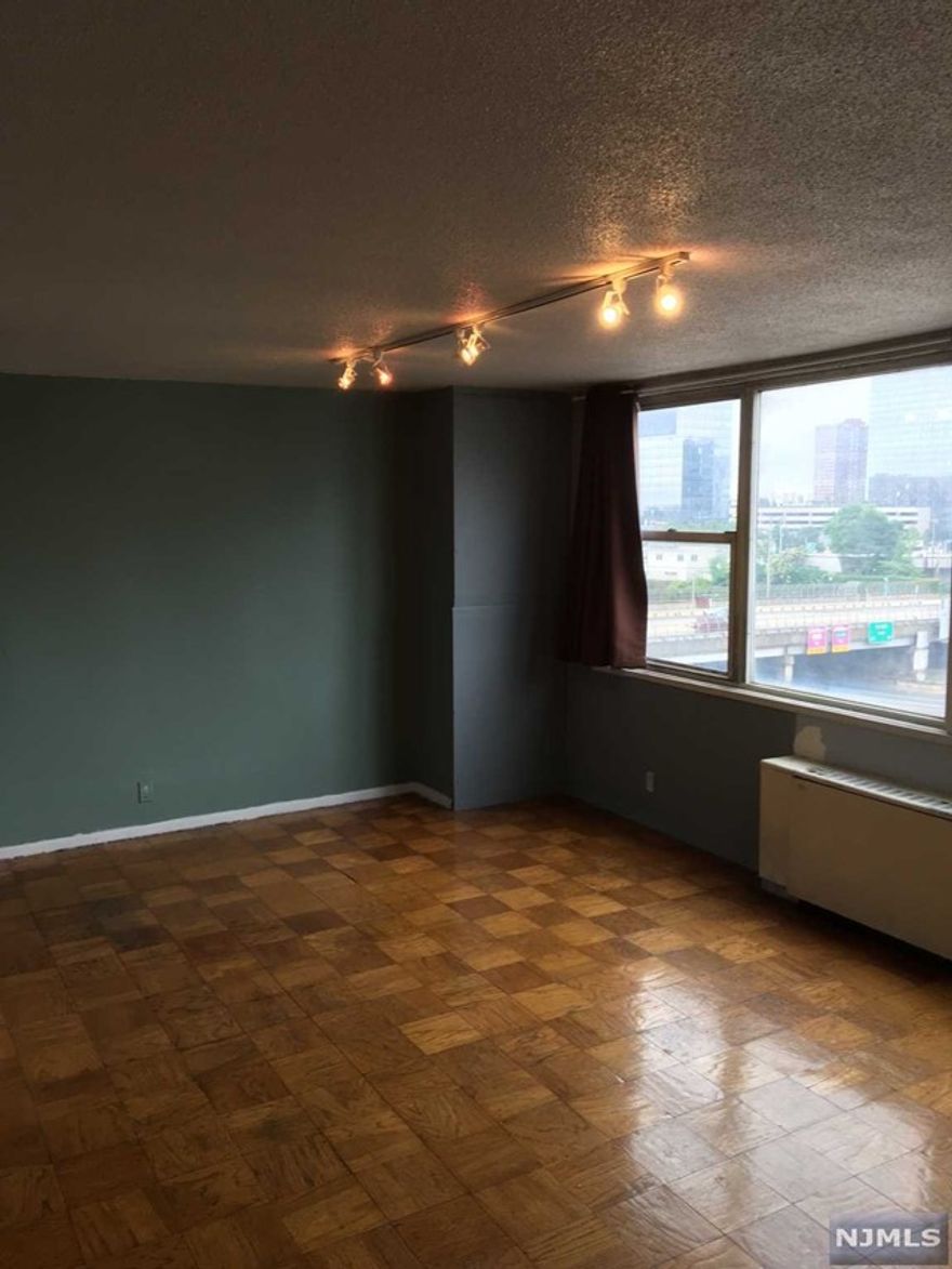 Nice large studio with walk in closet in elevator building. All utilities included. All you pay is rent and internet. Nice view, waling distance to all amenities. Bus to NYC right outside the building. Renovated bathroom, new stainless steel refrigerator and stove, 24 hour concierge. Laundry on site. No parking is available at this time due to parking garage construction. There is a waiting list and parking is an additional $130 per month when available.